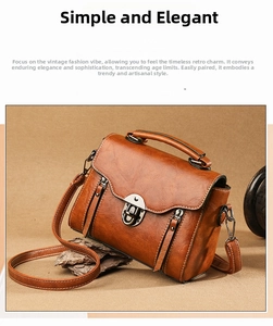 Detail view of caramel brown vintage crossbody bag with metal lock and textured leather