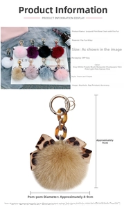 Detail view of fox fur ball keychain with leopard bowknot and alloy chain clip