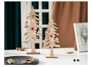 Detail of handcrafted wooden Christmas tree ornaments with owl and star patterns