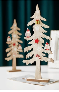 Detail of wooden Christmas tree decor with owl, star ornaments and festive red accents