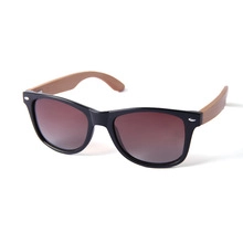 Detailed side view showing textured wooden temples and black frame of stylish sunglasses