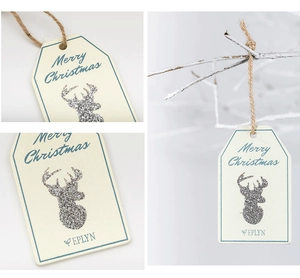 Detail of wooden Christmas tags with silver glitter reindeer and Merry Christmas text
