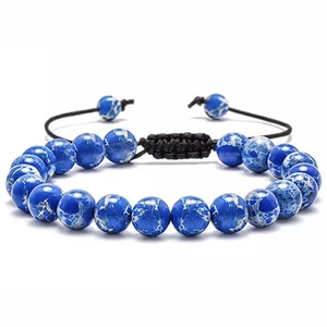 Detail of adjustable woven bracelet with blue natural stones and sliding knot closure