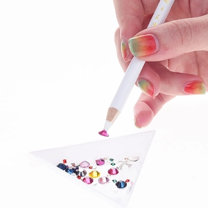 Multi-colored nail art rhinestones kit with white wax picker pen and sorting tray