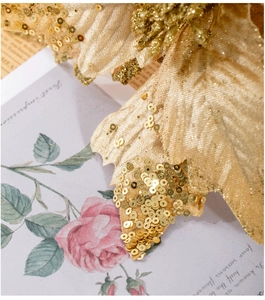 Macro view of 25cm champagne gold Christmas flower with glitter velvet leaf textures