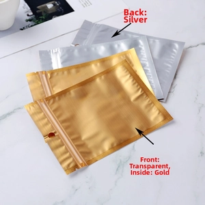 Detail of resealable foil bags with clear front, gold interior and hanging hole