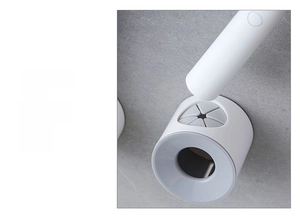 Detail of wall-mounted electric toothbrush holder with flexible grey silicone grip