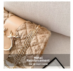 Detail of deer-shaped golden buckle on khaki faux fur crossbody bag with chain