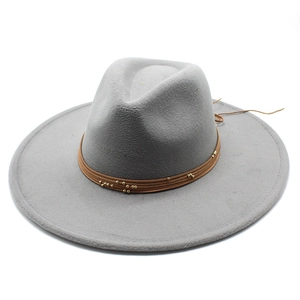 Top view of a grey wool fedora hat with brown leather band and gold bead accents