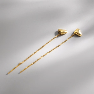 Elegant s925 silver heart tassel chain earrings with a polished gold finish and long drop