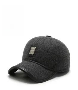 Close-up of winter baseball cap featuring warm wool fabric and premium leather brim edging