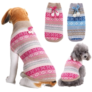 Detailed knit pet sweaters featuring snowflake patterns and festive pompom bow ties