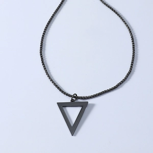 Detail of matte dark grey triangle pendant with a matching box chain necklace