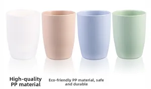 Close-up of four matte PP plastic travel cups in white, beige, blue and mint green colors