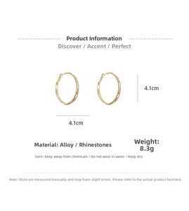 Detail view of 4.1cm gold C-shaped hoop earrings with rhinestone inlay and specifications