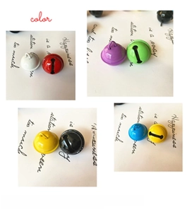 Close-up of multicolored 22mm painted metal bells for DIY crafts and pet collars