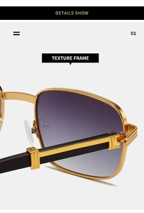 Detail of gold metal frame with T-shaped hinge and purple gradient sunglasses lens