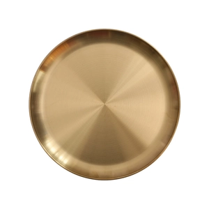 Nordic vintage style round gold metal storage tray with a brushed finish texture