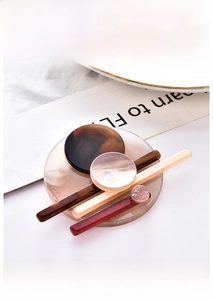 Detailed close-up of acrylic brooch set with elegant marble texture and glitter finish