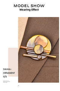 Close-up of geometric amber acrylic brooch pinned on a dark brown suit lapel