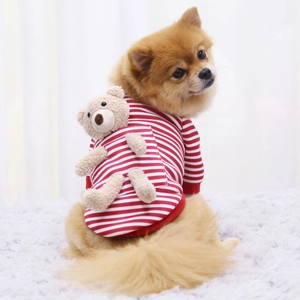Detailed view of red and white striped knit dog sweater with 3D plush bear on back