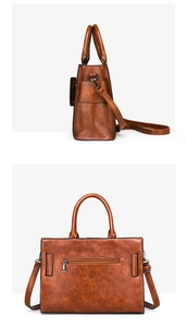 Detail view of the retro brown textured leather tote showing side profile and back zipper pocket