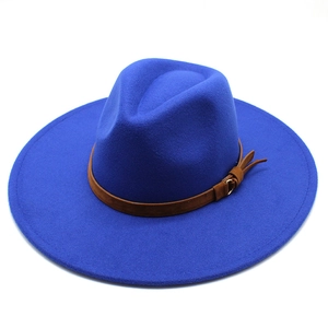 Detail of royal blue wide brim wool fedora hat with brown leather decorative belt