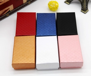 Detail showing jewelry boxes in six colors with diamond pattern texture on white background