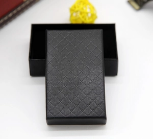Macro shot of rectangular black gift box with diamond embossed texture for jewelry
