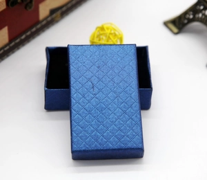 Detail of navy blue rectangle jewelry box featuring a premium diamond texture pattern