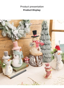 Close-up of assorted plush Christmas snowmen with knit hats and scarves for festive decor