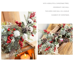 Detailed view of Christmas garland with red berries, pine cones, and soft cotton decor