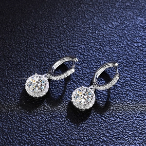 Macro detail of luxury Moissanite earrings with sparkling round stones in S925 silver