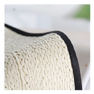 Straw sun hat with wide brim and black fabric edge detail for beach travel