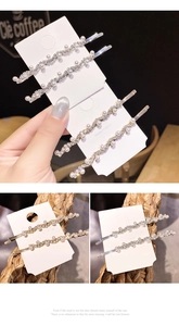 Close-up of wavy gold and silver hairpins with pearls and rhinestones on card