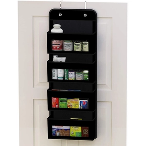 Black 5-tier wall-mounted organizer hanging on a white door storing medicine bottles