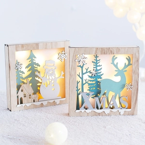 Illuminated wooden Christmas reindeer and snowman decor with warm LED light in hollow box