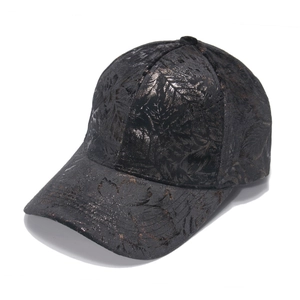 Classic curved brim baseball cap with metallic bronze floral print on dark textured fabric