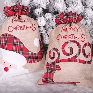 Christmas burlap gift bags with Santa and Reindeer designs and drawstring closure