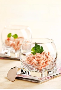 Detail showing crystal glass dessert cup with a square base and diamond light refraction