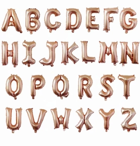 Macro view of rose gold foil balloons showing metallic luster on 26 alphabet shapes