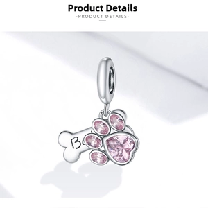 Detailed close-up of S925 silver pet charm with pink heart gems and bone pendant
