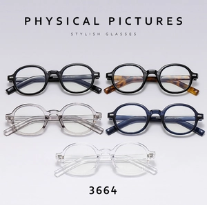 Flat lay of retro round glasses frames in black, tortoiseshell, grey, blue, and clear