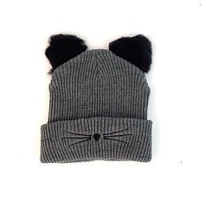 Detail view of the gray knit beanie featuring cat face embroidery and fuzzy ears