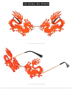 Detail of red dragon-shaped frameless sunglasses with gold metal temples and artistic design