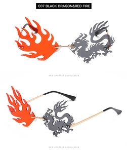 Detail view of dragon and flame shaped rimless sunglasses with gold metal frame