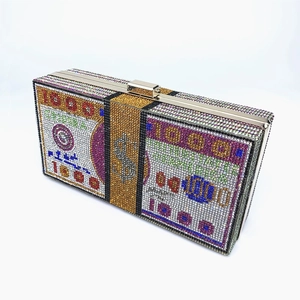 Detailed view of 1000 Dollar bill evening clutch bag with colorful rhinestones and gold clasp