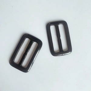 Detail of dual-hole rectangular resin belt buckles for winter wool coats in black