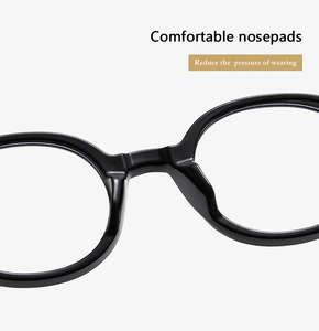 Close-up of integrated nose pads on black round frame glasses for enhanced comfort