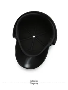 Detail view of winter hat showing black faux fur lining and inner fabric construction